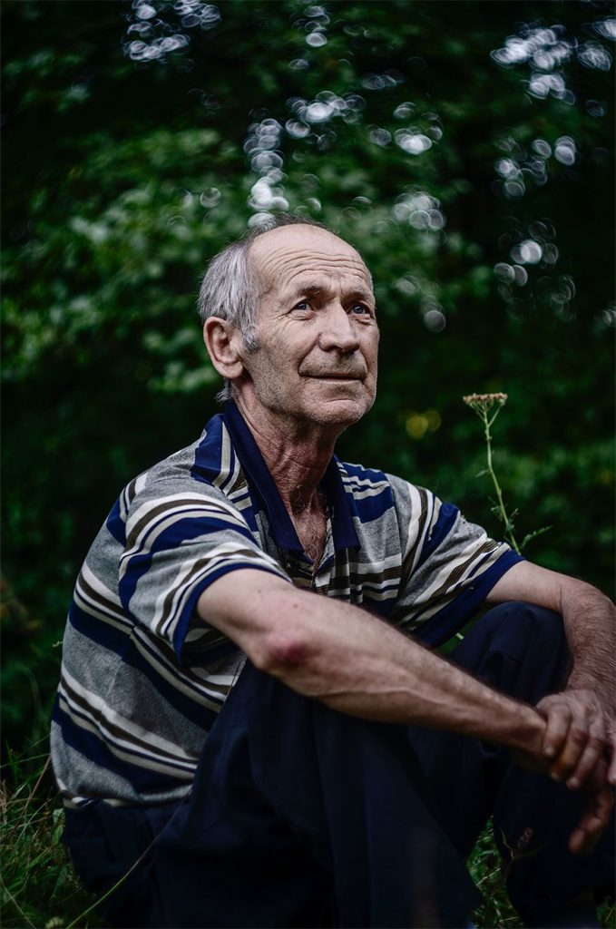 man-sat-down-in-garden